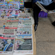 A Kenyan newspaper vendor (R) reads a newspaper featuring front page article about US President-elect Donald Trump as he waits for customers at a street in Nairobi, Kenya, 10 November 2016. Americans on 08 November chose Republican candidate Donald Trump as the 45th President of the United States of America, to serve from 2017 through 2020.